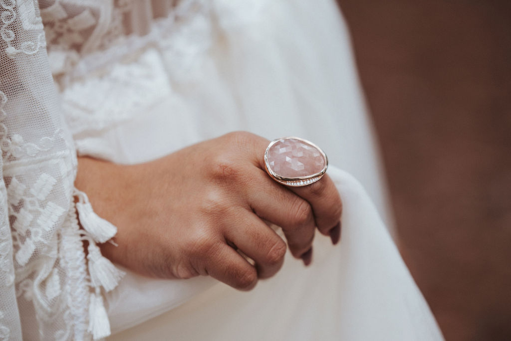pink gemstone wedding ring on Seattle bride with wedding dress